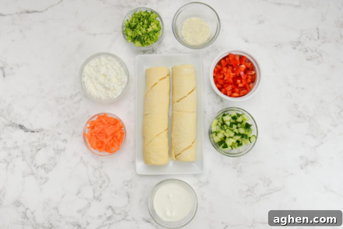 The ingredients for cold veggie pizza are placed in various size bowls