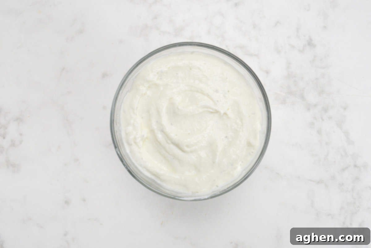Close up of a small bowl filled with the blended cottage cheese ranch 
