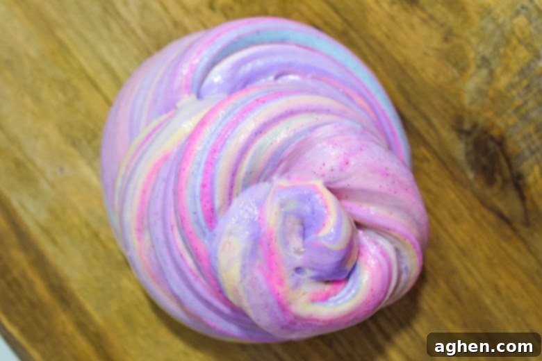 Pink, purple, teal, and yellow fluffy unicorn slime