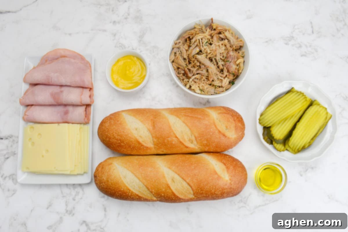 Öğle Yemeğiniz Asla Aynı Olmayacak: Blackstone Küba Sandviçi 3 Various ingredients for Blackstone Cuban Sandwiches laid out on a clean surface, including bread, cheese, ham, pork, mustard, and pickles.
