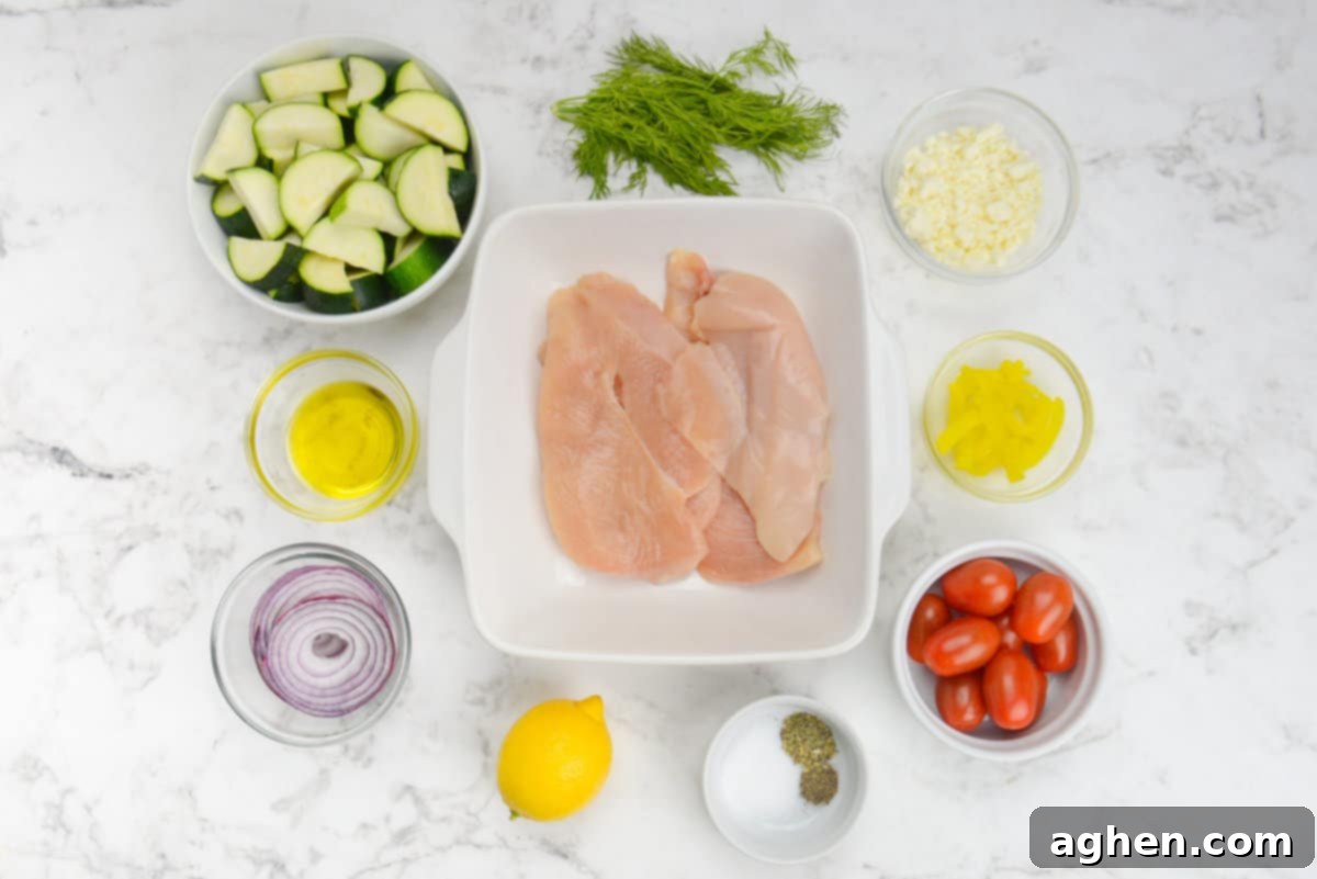 Effortless Delicious Weight Watchers Greek Sheet Pan Chicken 3 The ingredients to make Greek sheet pan chicken are placed in various size bowls