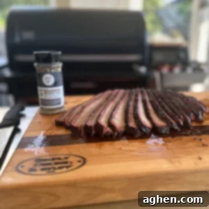 Traeger Brisket The Ultimate Guide To Perfection 9 Overnight Backyard Brisket, perfectly smoked and ready to slice for serving on a wooden board