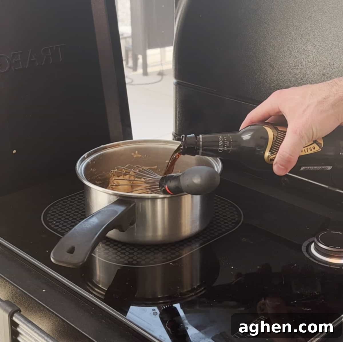 Guinness gravy simmering in a saucepan