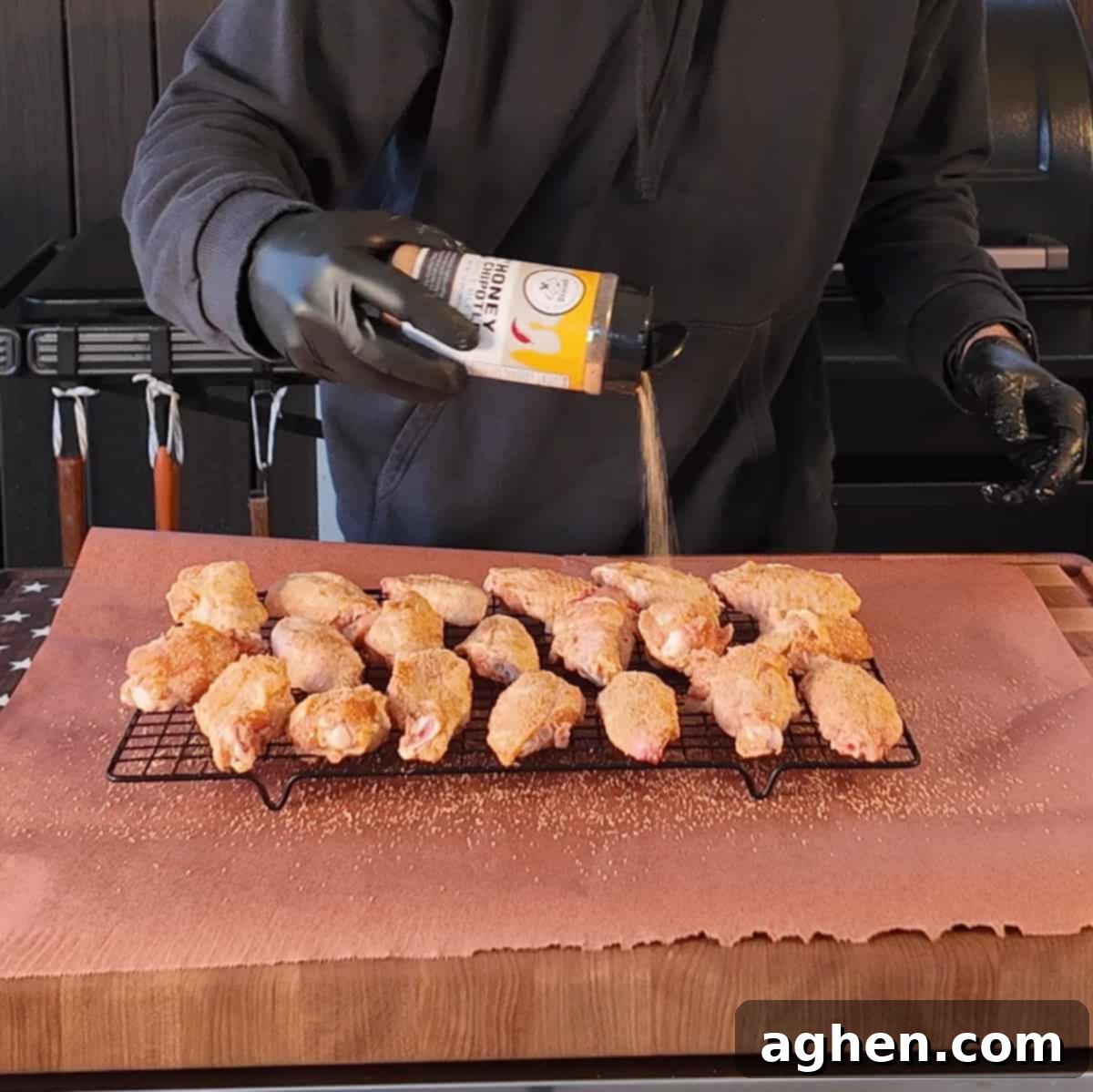 Chicken wings arranged on a wire rack, ready for the smoker