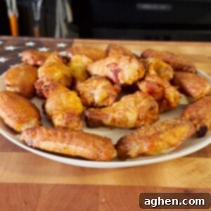 smoked crispy wings on white plate