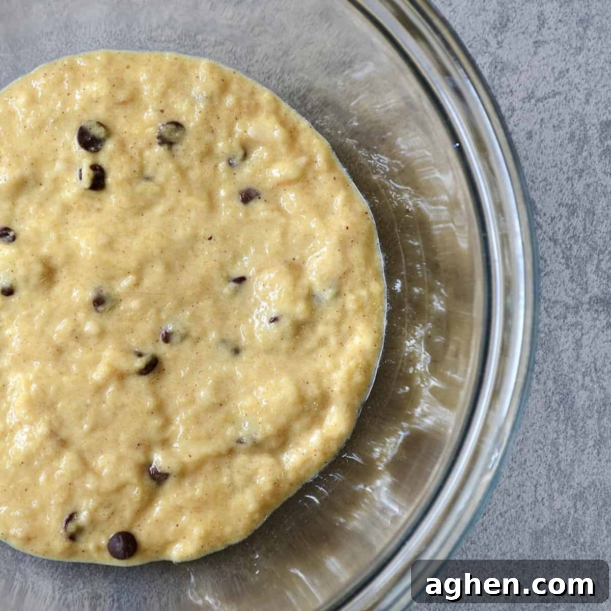 Easy Weight Watchers Banana Chocolate Chip Mug Cake 4 Mug cake ingredients mixed in a bowl, ready for microwaving