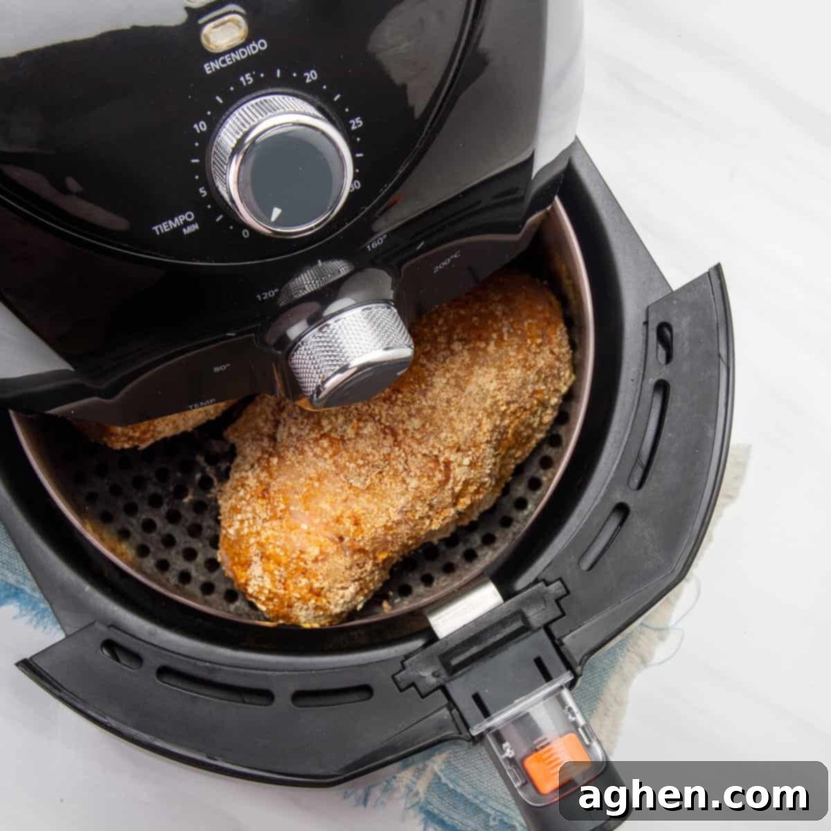 Weight Watchers Chicken Cordon Bleu Reimagined 8 Air fried chicken cordon bleu rolls in an air fryer basket, golden brown and crispy