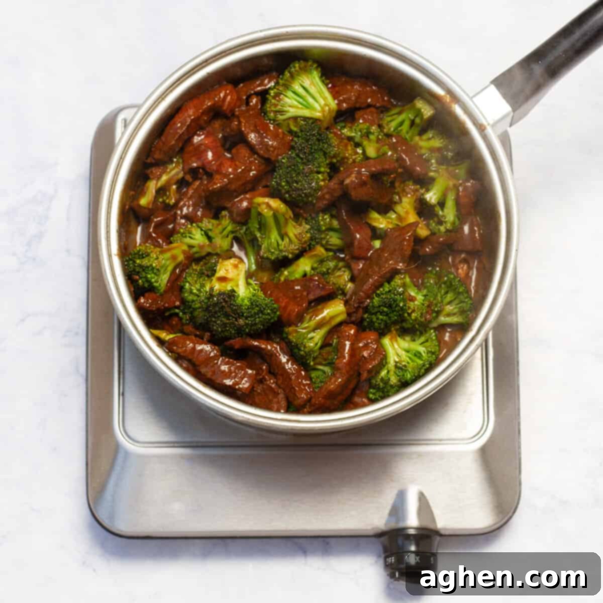 Homemade Weight Watchers Beef and Broccoli Outshines Takeout 7 cooking beef in the skillet, along with the blanched broccoli florets