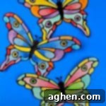 How to make a faux stained-glass butterfly craft using cardstock, glue, watercolors, and the provided printable butterfly template.