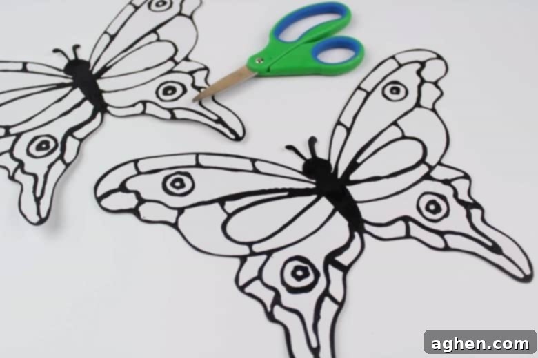Scissors and butterfly template on white cardstock