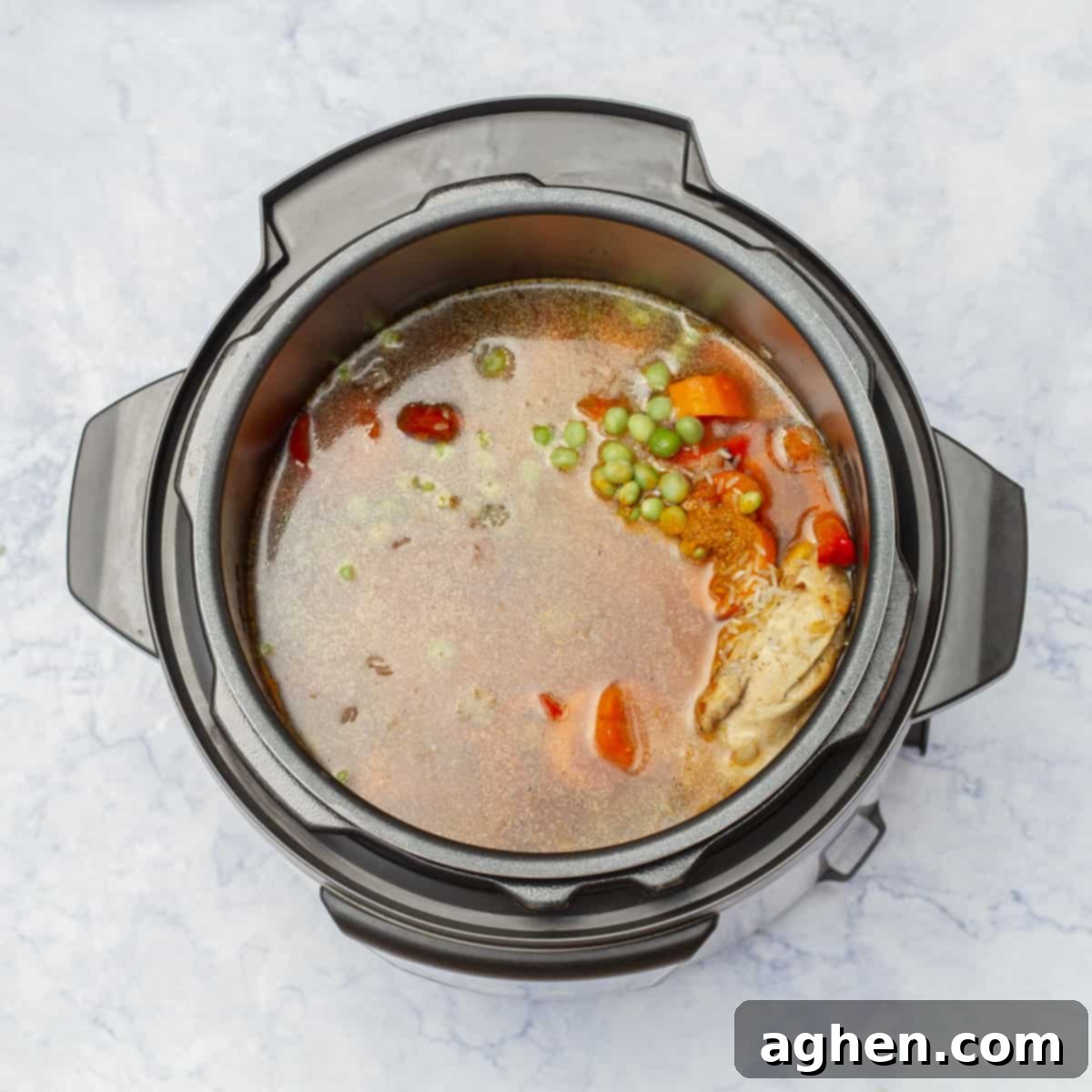 Easy Instant Pot Cuban Arroz Con Pollo 6 Tomato Paste and Chicken Broth added to instant pot