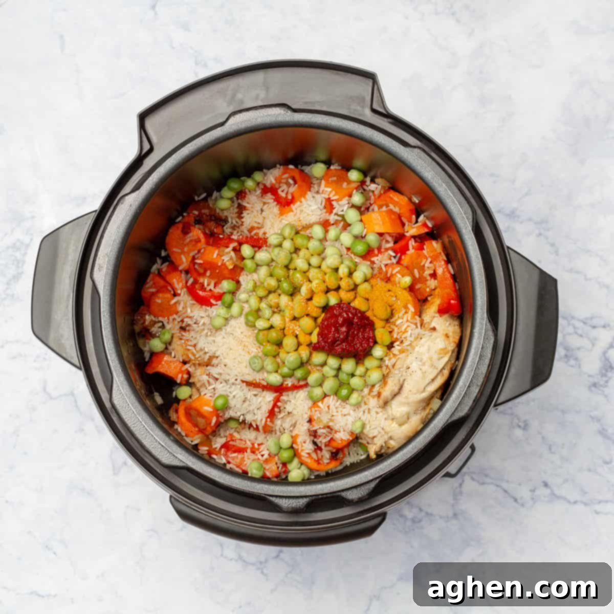 Easy Instant Pot Cuban Arroz Con Pollo 7 Rice and Chicken added to instant pot with vegetables