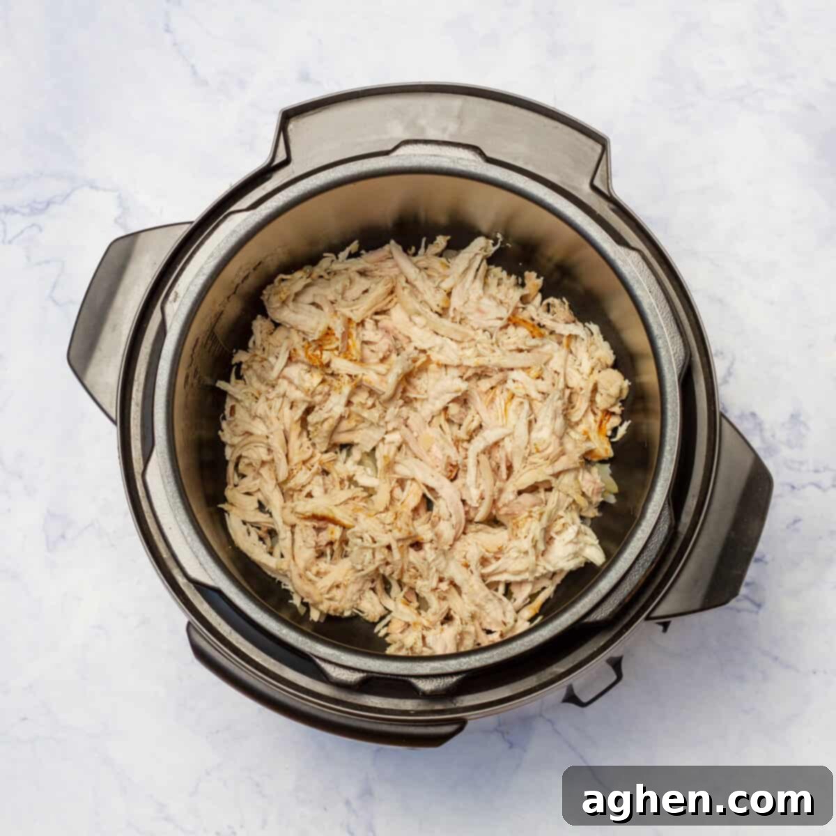 Added the shredded cooked chicken to the pot with onion and garlic