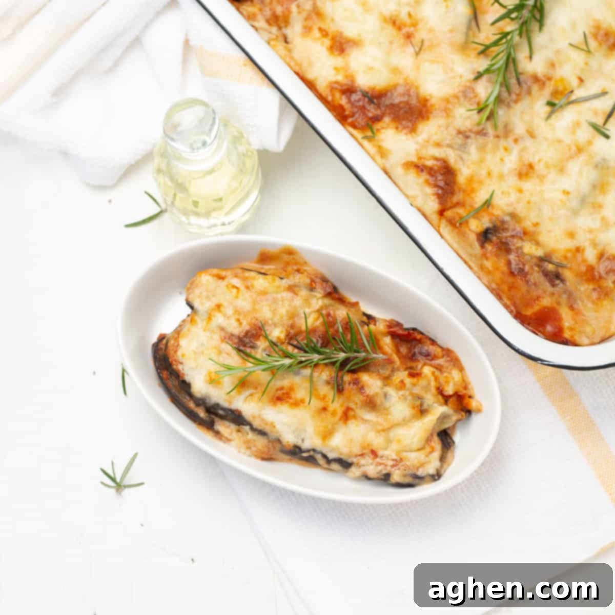 Eggplant Parmesan served in plate and baking tray