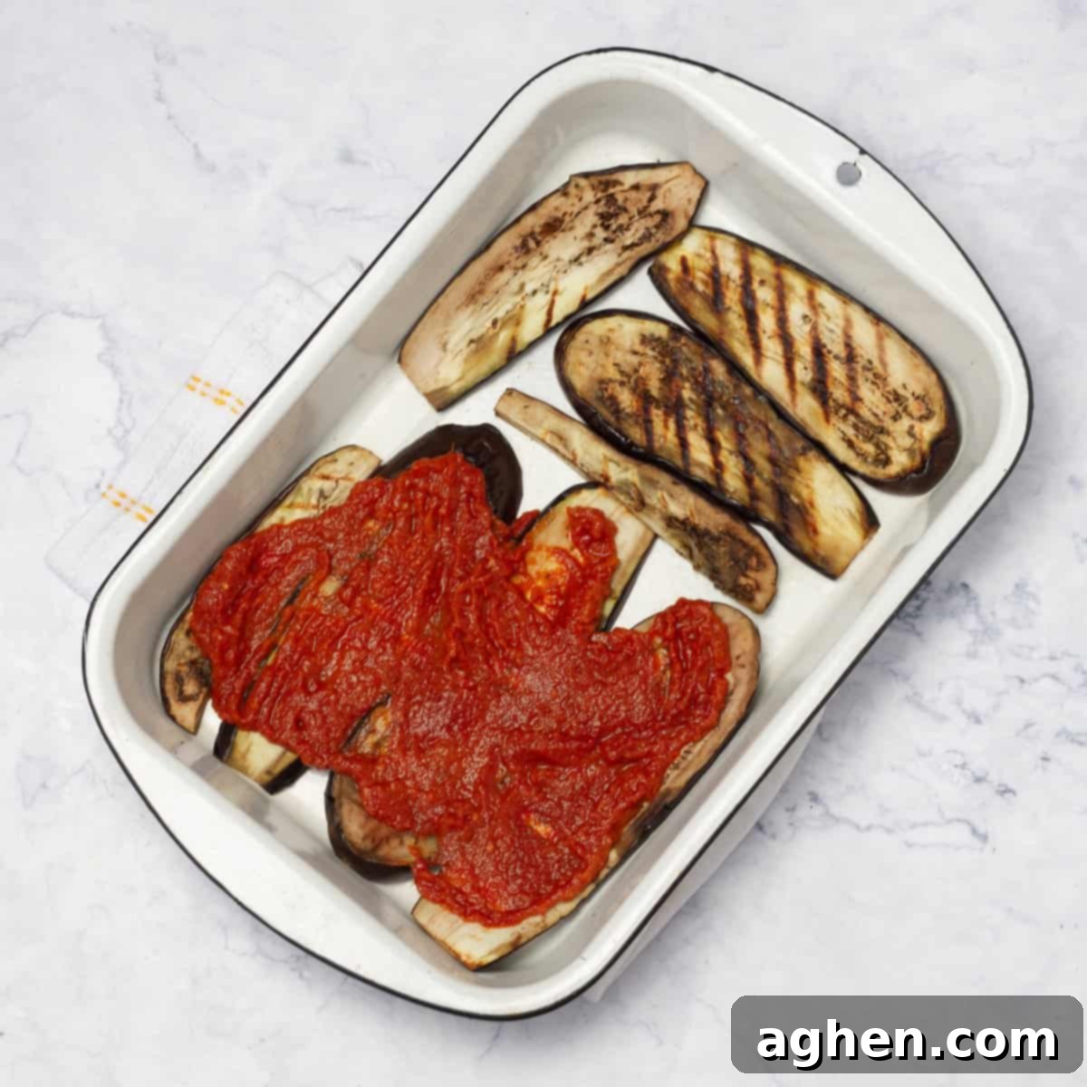 spoon some marinara sauce over the eggplant slices