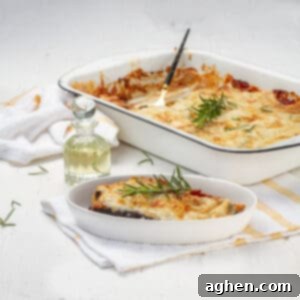 Eggplant Parmesan served in plate and baking tray