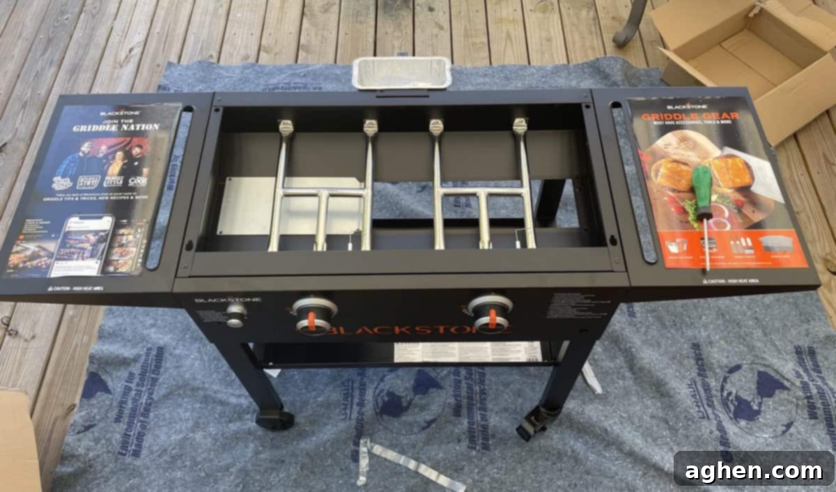 Blackstone griddle being assembled on a mat