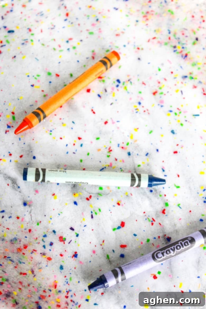An easy and colorful DIY crayon slime project that helps you use up broken crayons.
