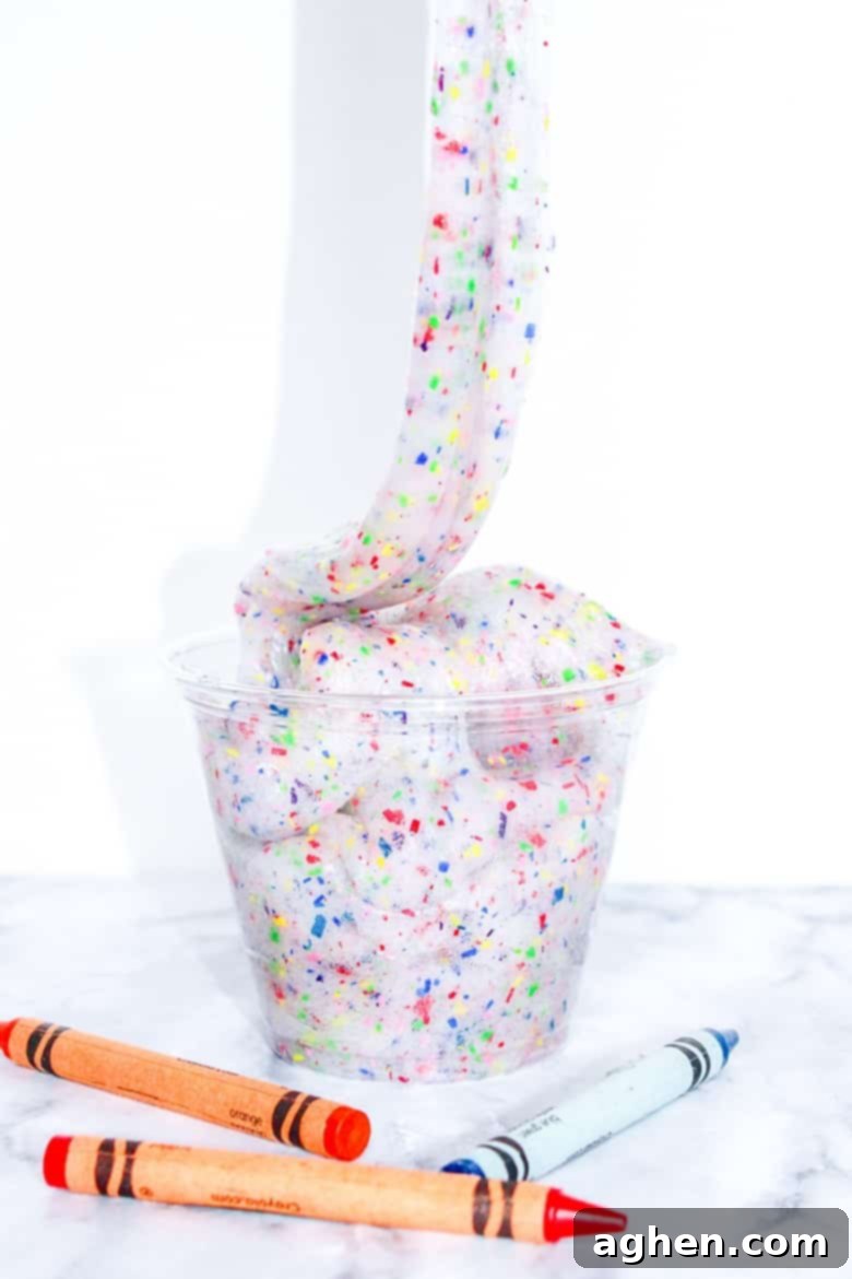 An easy and colorful DIY crayon slime project that helps you use up broken crayons.