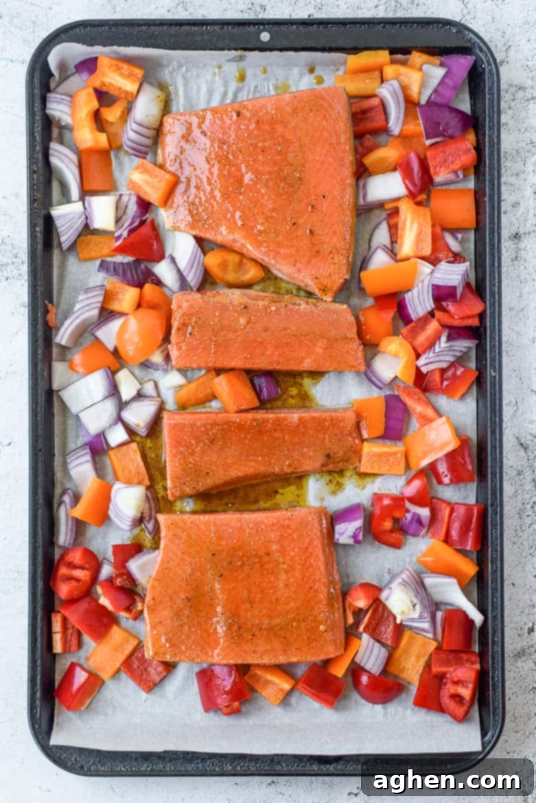This sheet pan chili lime salmon dinner, featuring beautifully cooked salmon and colorful vegetables, is on the table in under 30 minutes -- perfect for busy weeknights.