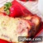 Easy homemade strawberry yogurt pound cake with a strawberry glaze and fresh strawberries.