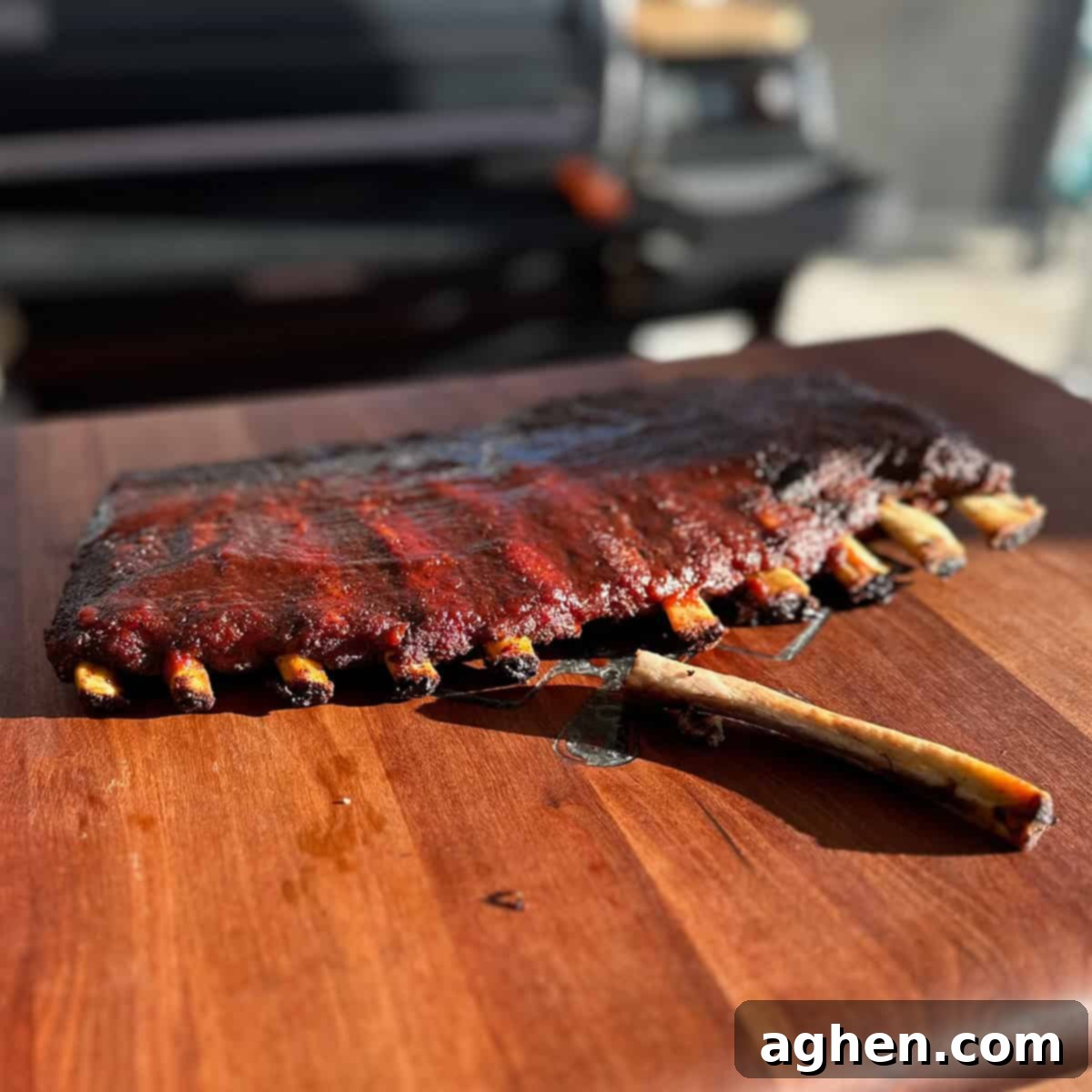 Perfect Traeger Fall Off The Bone Ribs 2 Perfectly smoked fall-off-the-bone ribs on a Traeger grill, ready to be served.