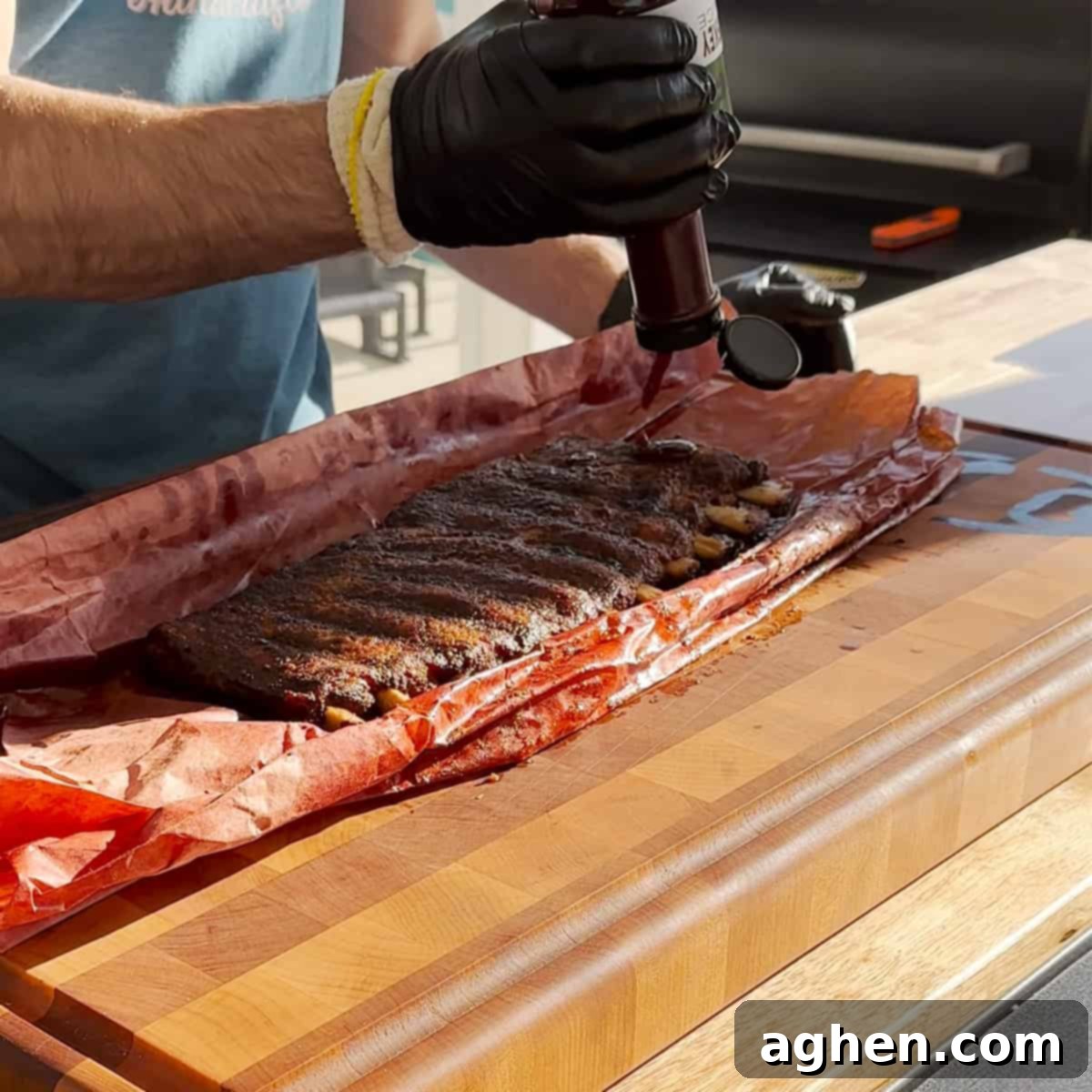 Perfect Traeger Fall Off The Bone Ribs 6 Sauced fall-off-the-bone ribs resting on a Traeger grill for the final glaze.