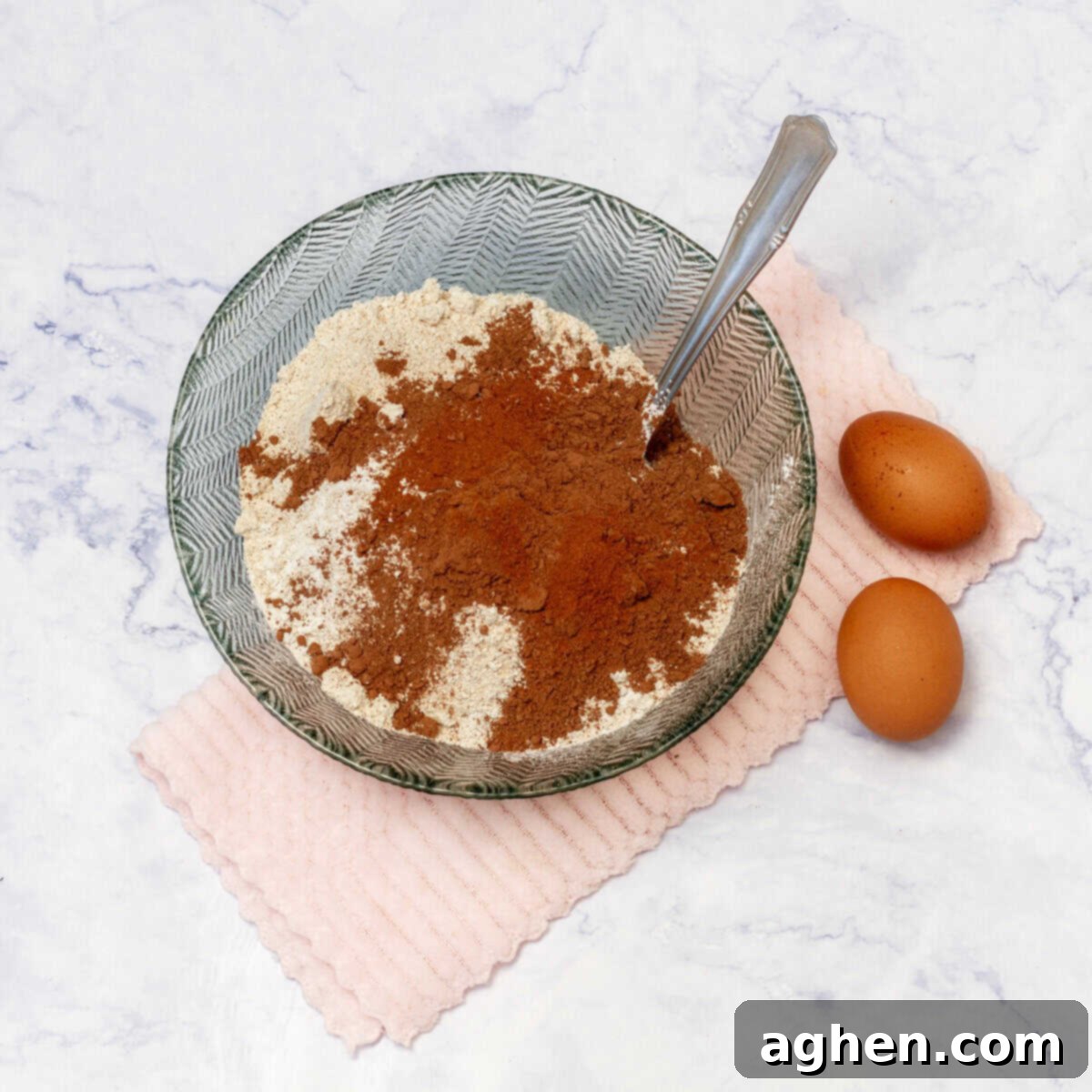 Irresistible Gluten-Free Chocolate Treats 4 A large mixing bowl having flour, cocoa powder spoon and 2 eggs laying on floor