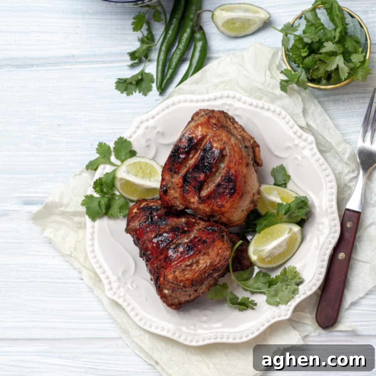 Jerk Chicken served in a plate, garnished with fresh herbs