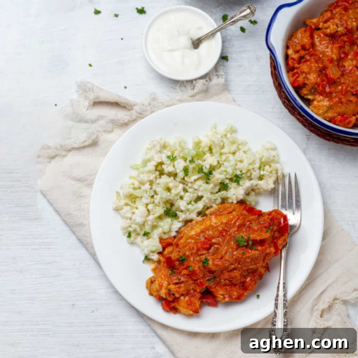 Velvety Chicken Paprikash 2 Chicken Paprikash served with cauliflower rice, garnished with fresh parsley