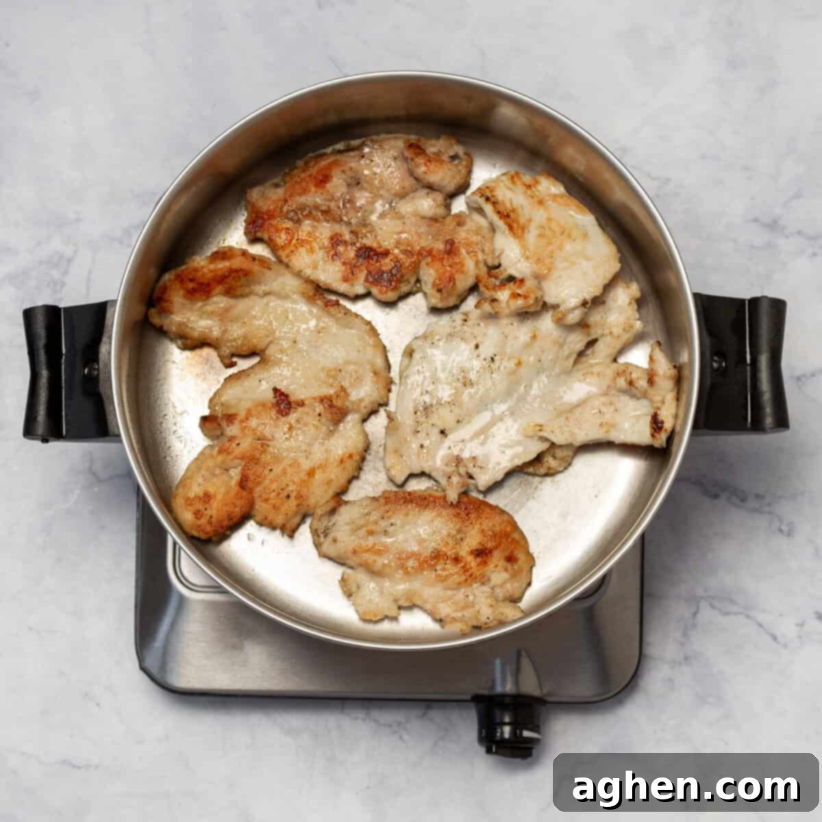 Velvety Chicken Paprikash 5 Browning floured chicken breasts in a hot skillet until golden
