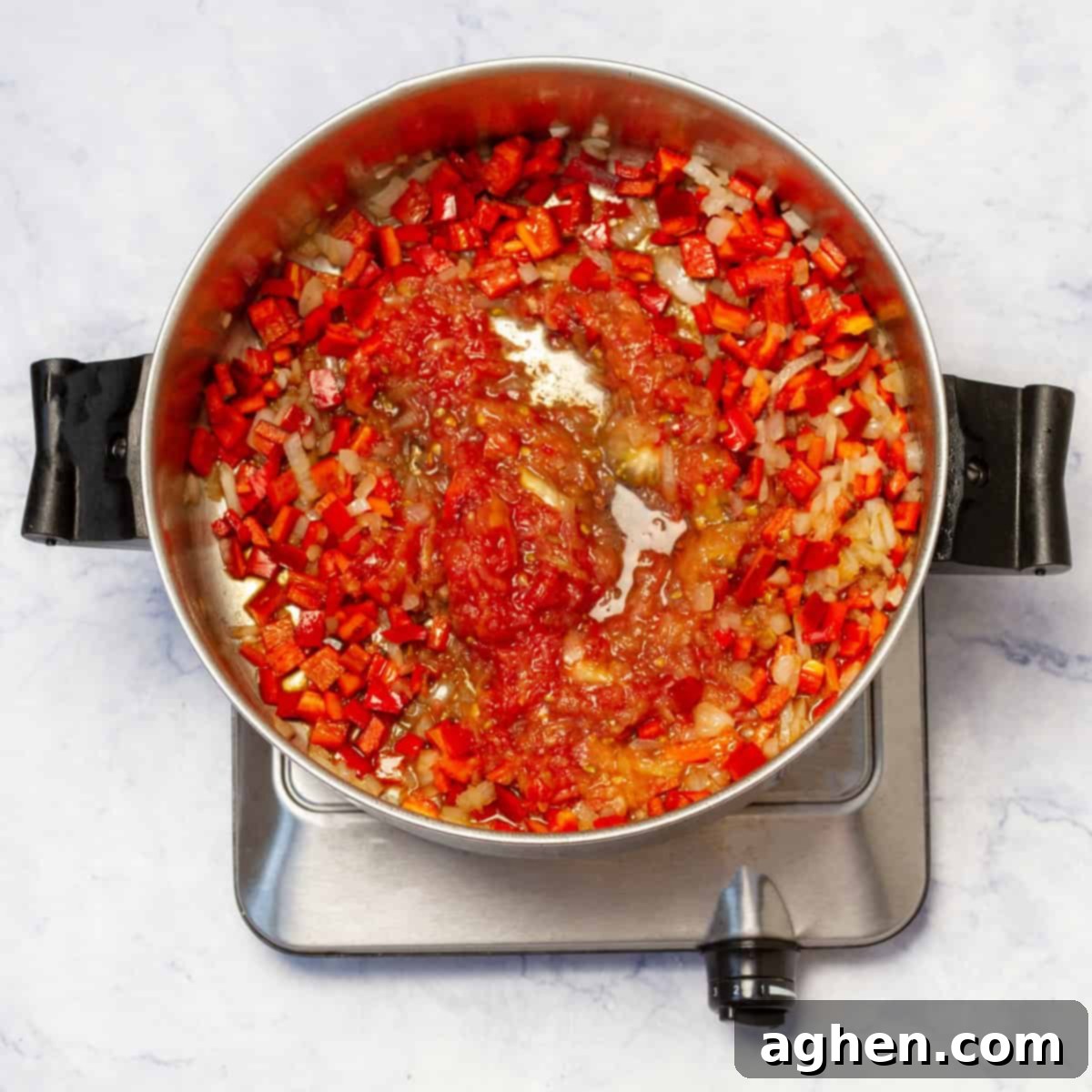 Velvety Chicken Paprikash 6 Sautéing chopped onions and diced red bell pepper in the same skillet