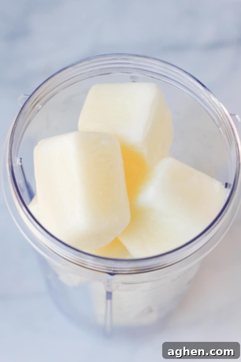 Frozen milk cubes in a Nutribullet blender cup