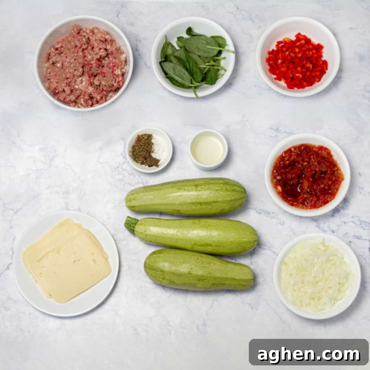A vibrant selection of fresh ingredients for Zucchini Cannelloni, including zucchini, ground pork, and tomatoes.