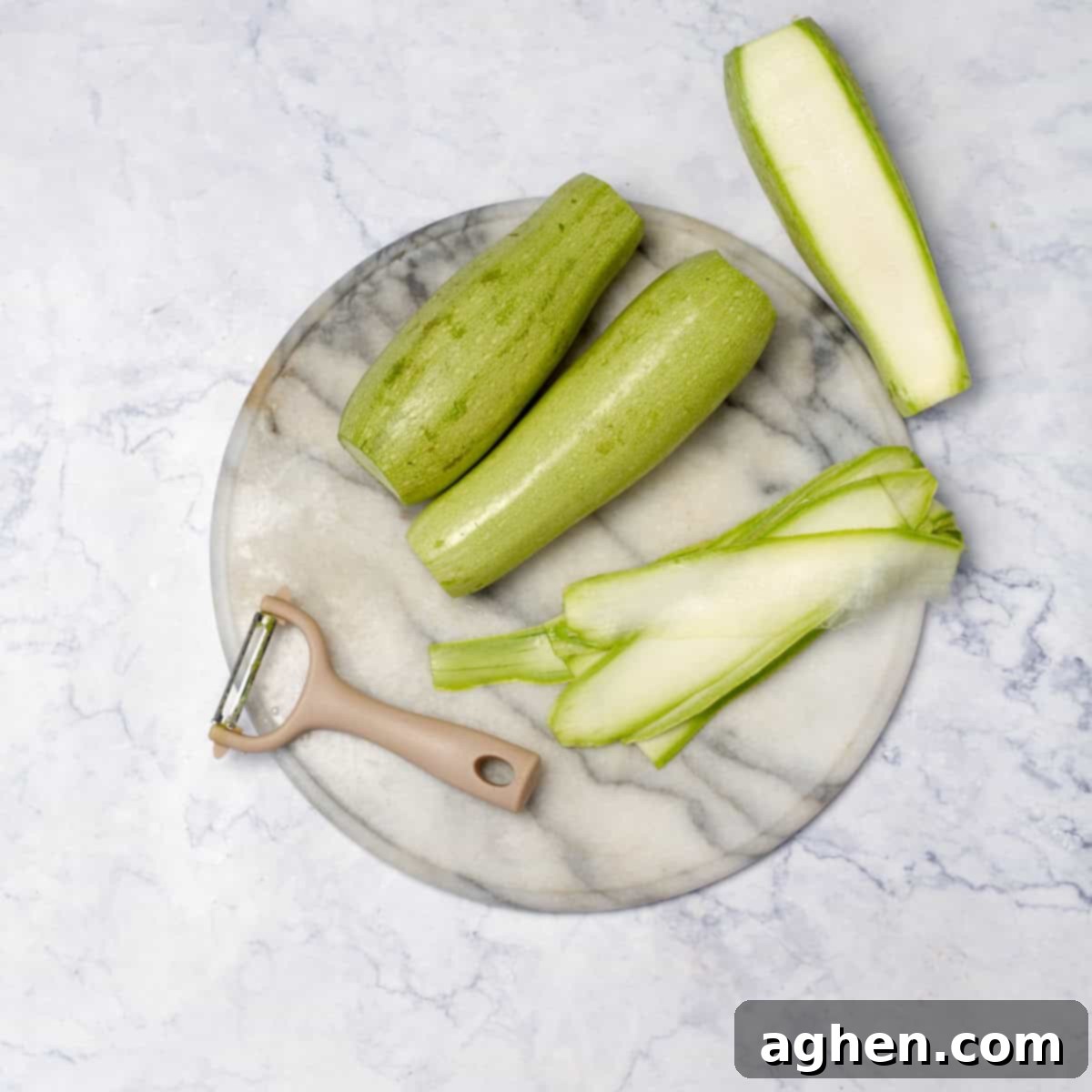 A large zucchini being thinly sliced lengthwise with a mandoline, preparing for cannelloni rolls.