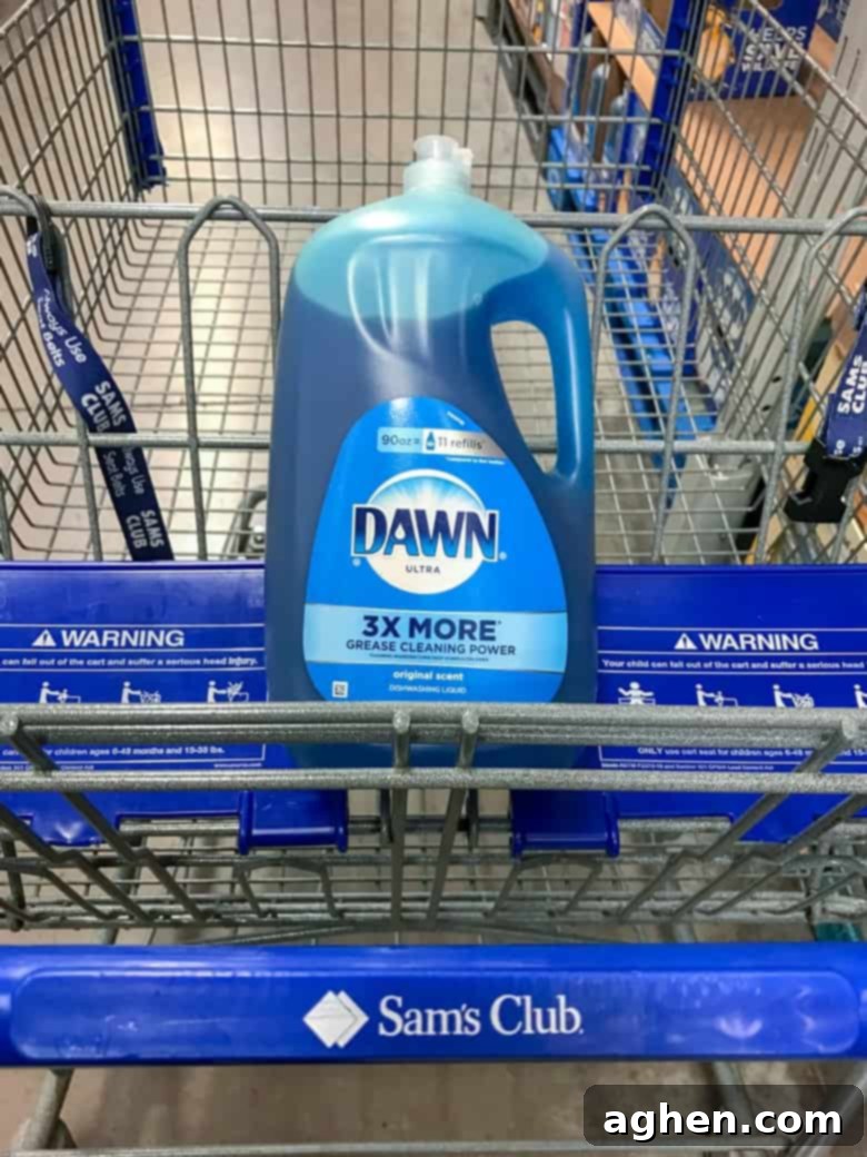 A large 90 oz bottle of blue Dawn Ultra prominently displayed in a Sam's Club shopping cart, signifying bulk purchase