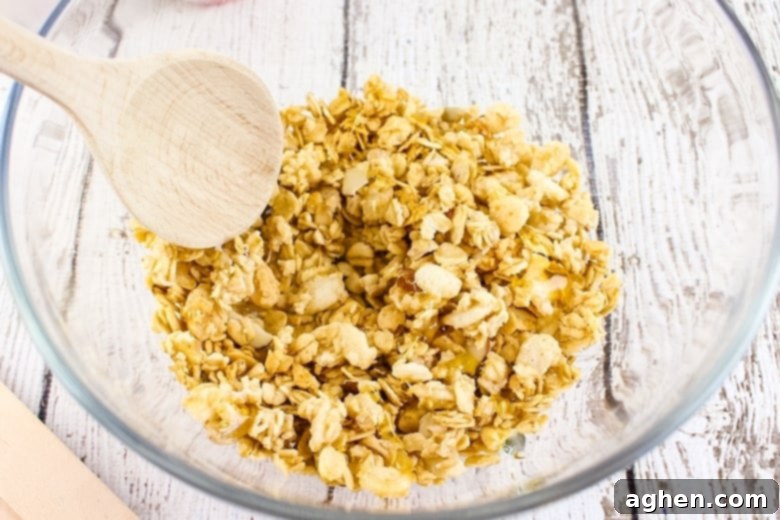 Bowl of granola with a wooden spoon