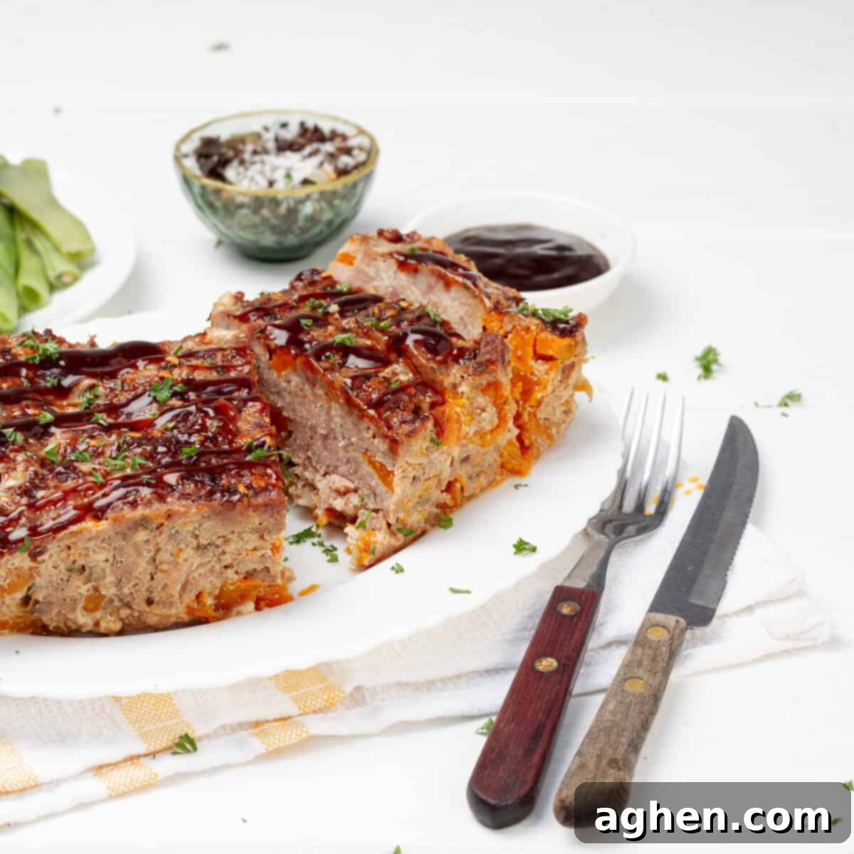 Martha Stewarts Butternut Squash Meatloaf For Weight Watchers 8 Pork Meatloaf served in a plate with spoon and fork