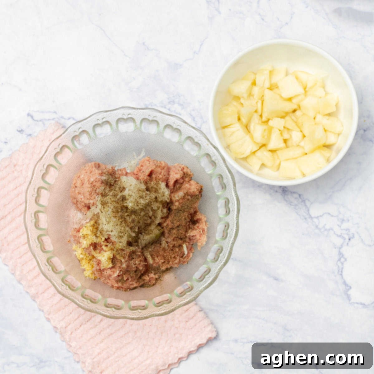 Preparing the meatball mixture in a large bowl