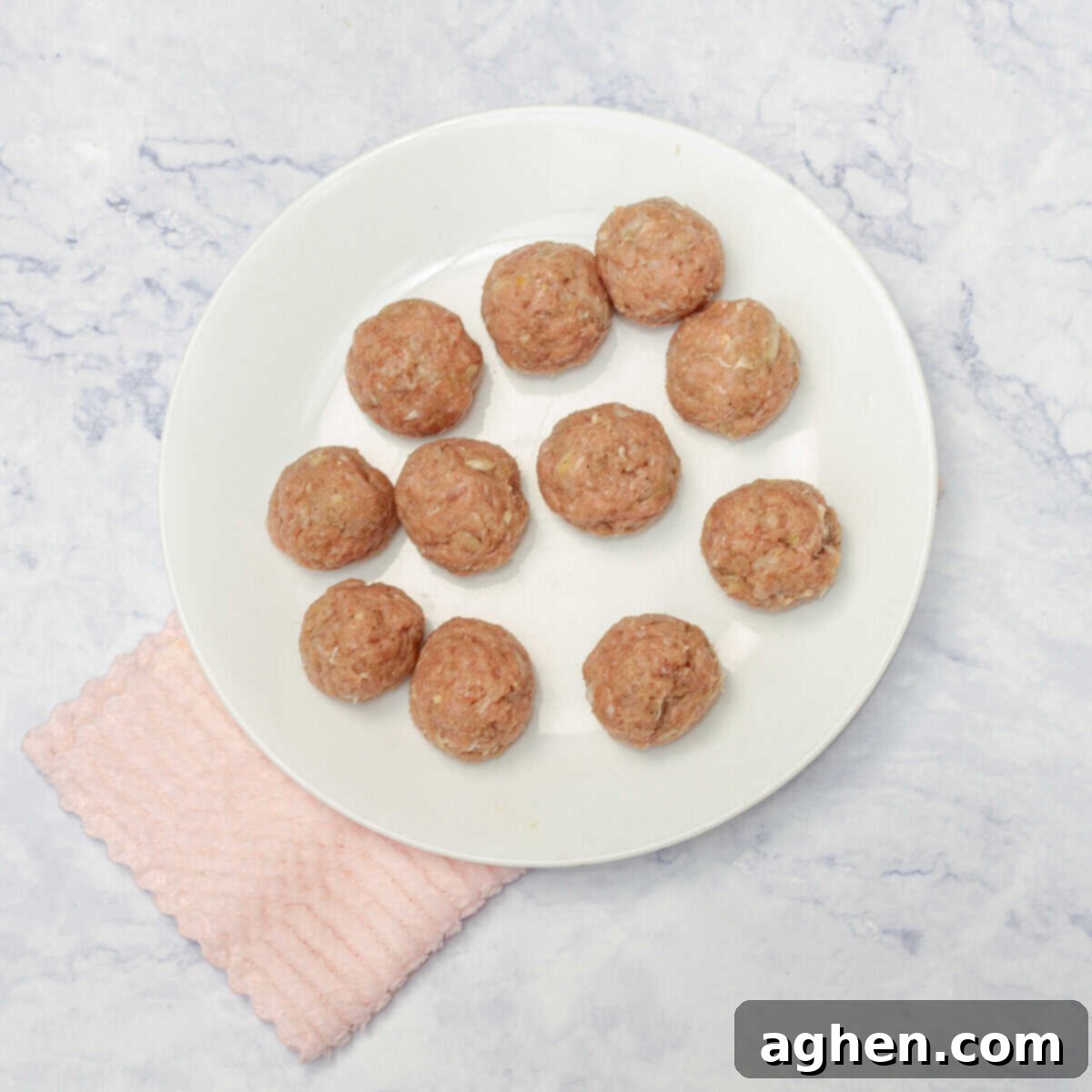 Forming small, uniform pork meatballs by hand