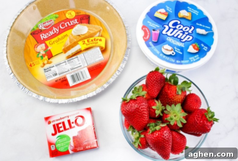 Effortless Strawberry Gem Pie 3 Keebler Graham Ready Crust, Cool Whip, fresh strawberries, and Strawberry Jello.