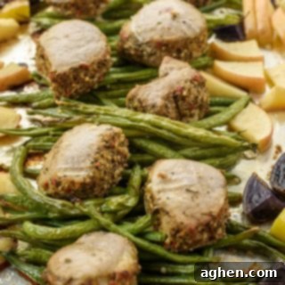 Potatoes, green beans, apples, and pork tenderloin medallions on sheet pan