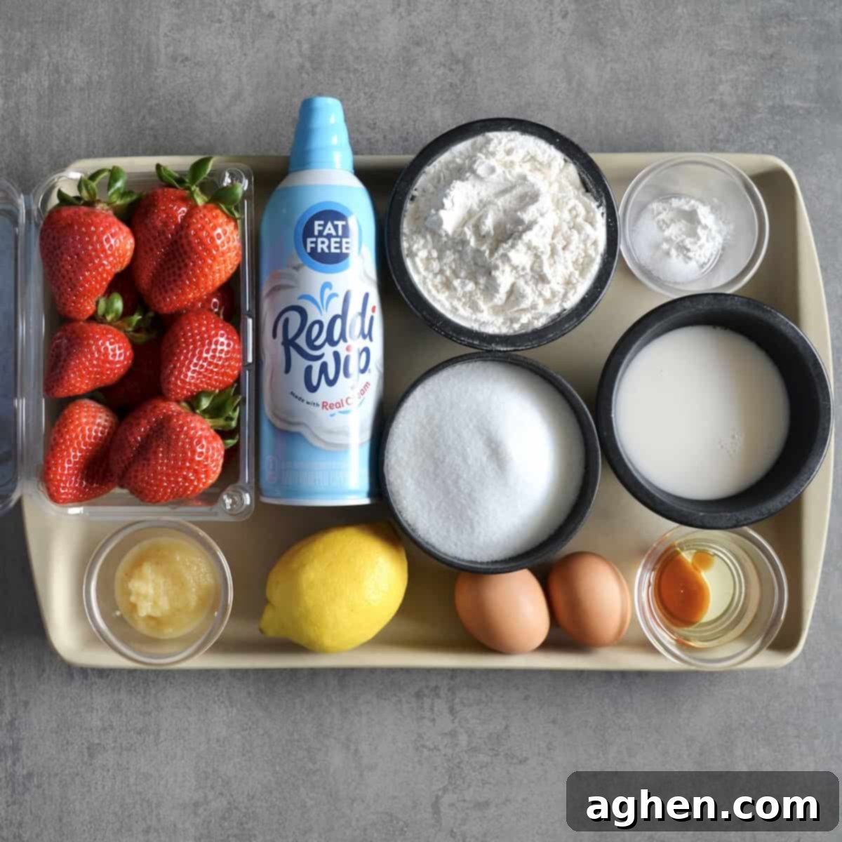 Measured ingredients for pound cake and strawberries