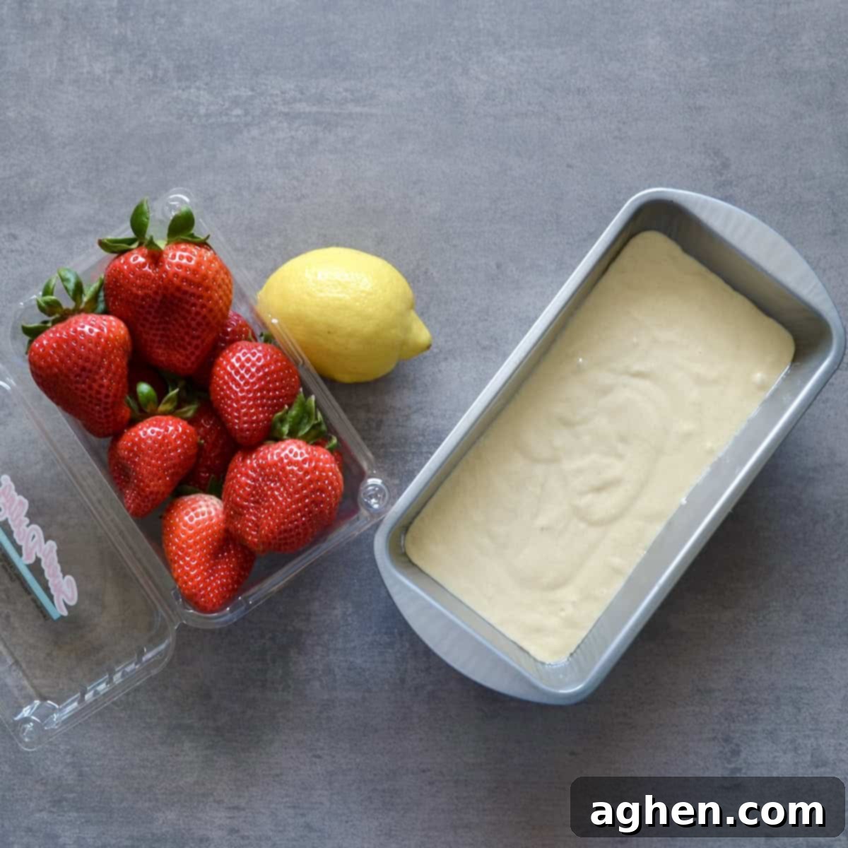 Cake batter in loaf pan with fresh fruit
