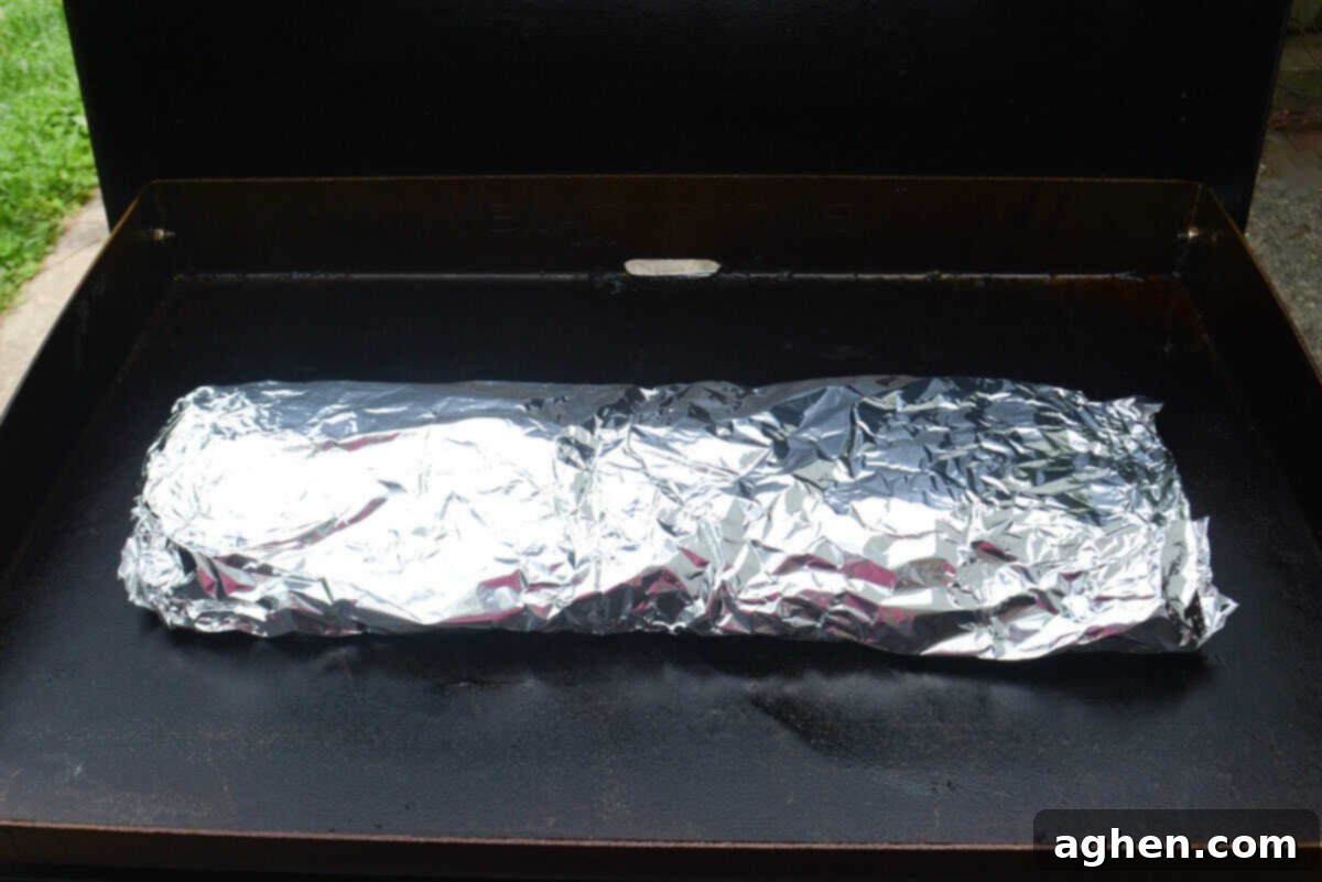Achieving Perfect Ribs on Your Blackstone Griddle 8 The ribs wrapped in foil on the Blackstone