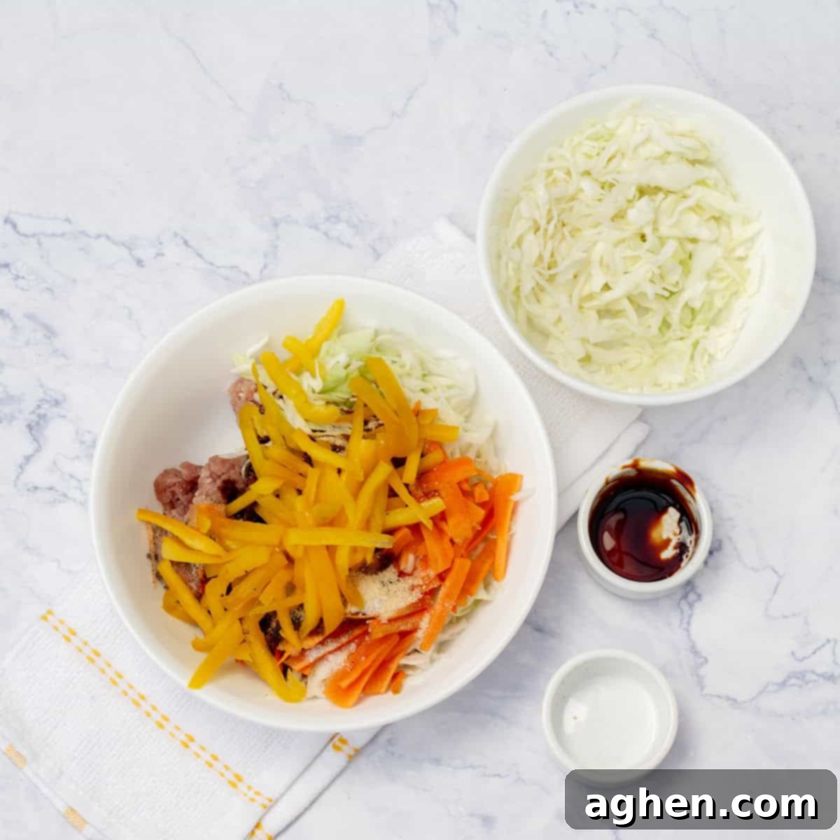 Ditch Takeout for These Weight Watchers Pork Egg Rolls 4 A large mixing bowl filled with the prepared pork and vegetable egg roll filling, beside a bowl of white rice, ready for assembly.