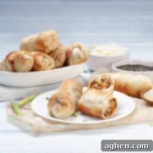 Ditch Takeout for These Weight Watchers Pork Egg Rolls 10 Air Fryer Pork Egg Rolls served on a dish with a side of dipping sauce