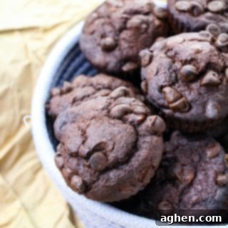 Ultimate Double Chocolate Banana Muffins 5 Double chocolate muffins in woven bowl
