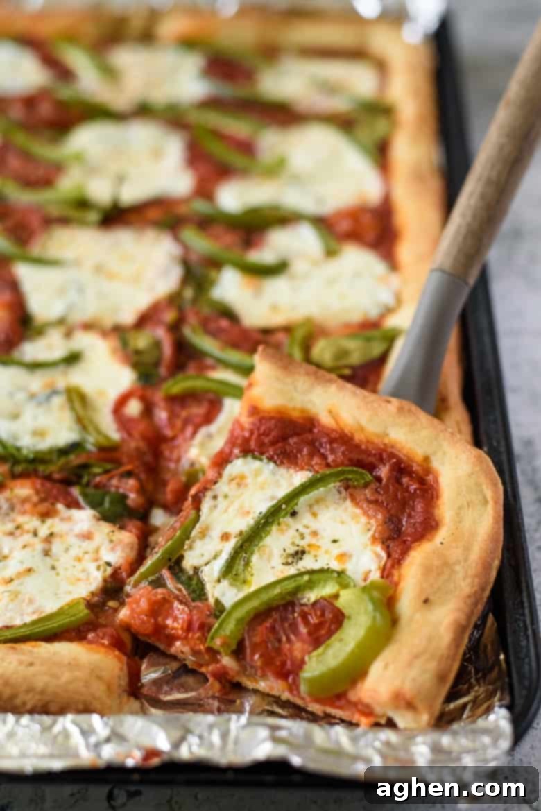 One-Pan Wonder Pizza 2 Sheet Pan Pizza in foil lined pan.