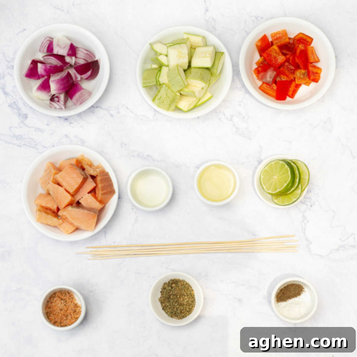 Zesty Herb Salmon Skewers 3 All ingredients for salmon skewers laid out on a cutting board